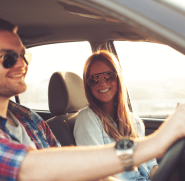 Couple driving in car using 7" pioneer touchscreen navigation tuner