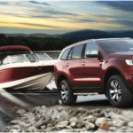 4WD towing boat out of lake on a trip communicating with UHF CB Radio