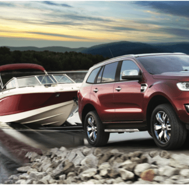 4WD towing boat out of lake on a trip communicating with UHF CB Radio